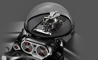 Illustration for article titled There's an Incredibly Complex Clock Inside This Miniature Mechanical Man